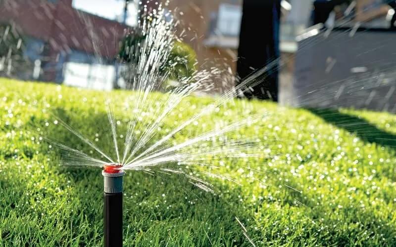 sprinkler system spraying grass